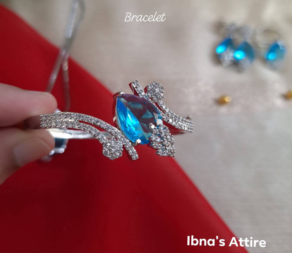Rhodium Polish Aqua Blue Monalisa Stone & American Diamond 4-Piece Jewelry Set | Delicate Crystal Pendant Necklace, Bracelet, Earrings & Adjustable Ring