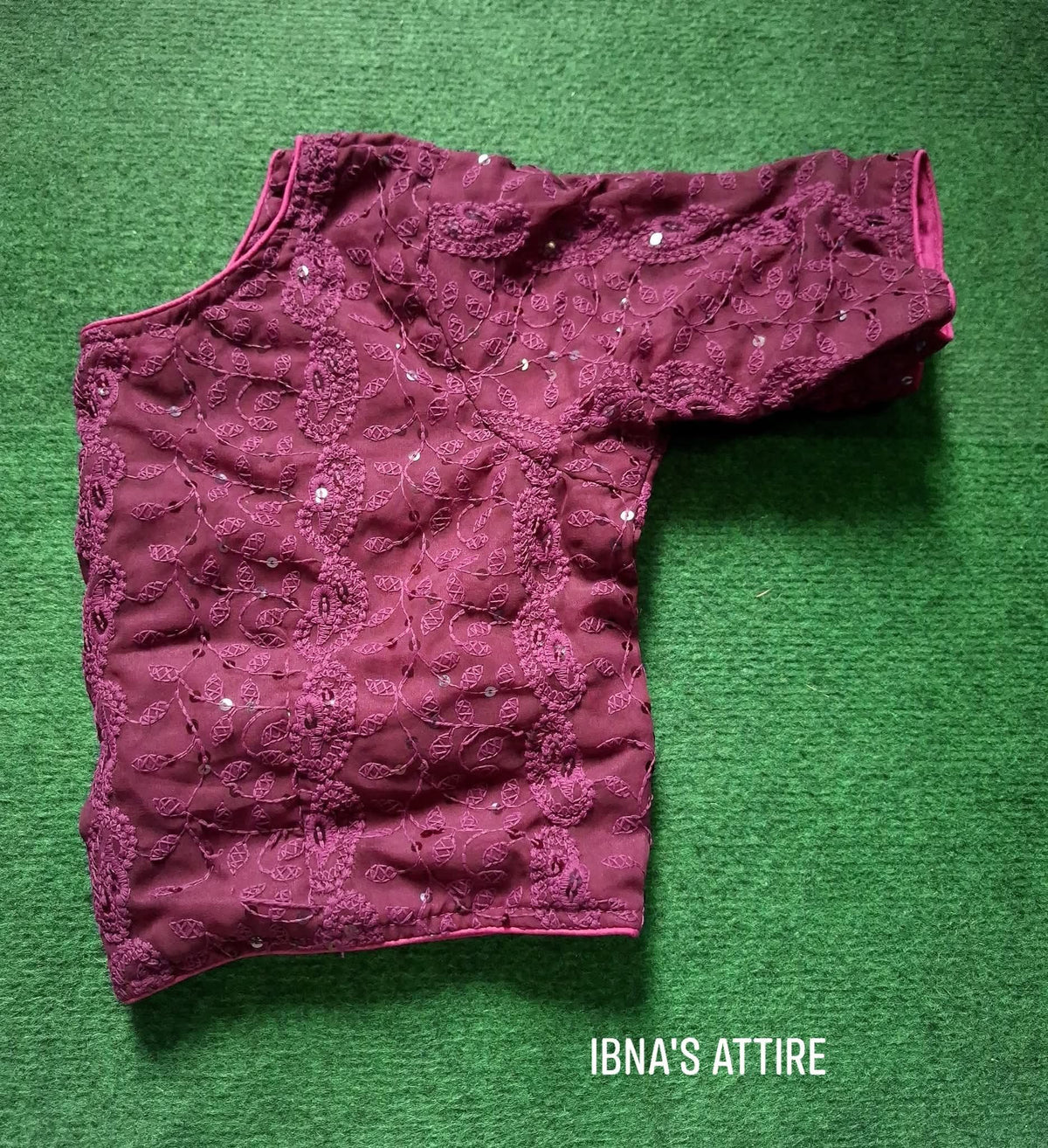 Soft Georgette Chikankari Blouse  purple / wine color lying on a greeny background
