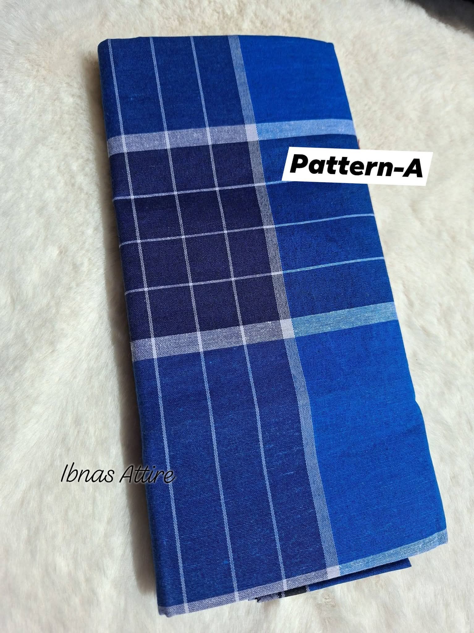 Folded cotton lungi in blue pattern on a whibackground 