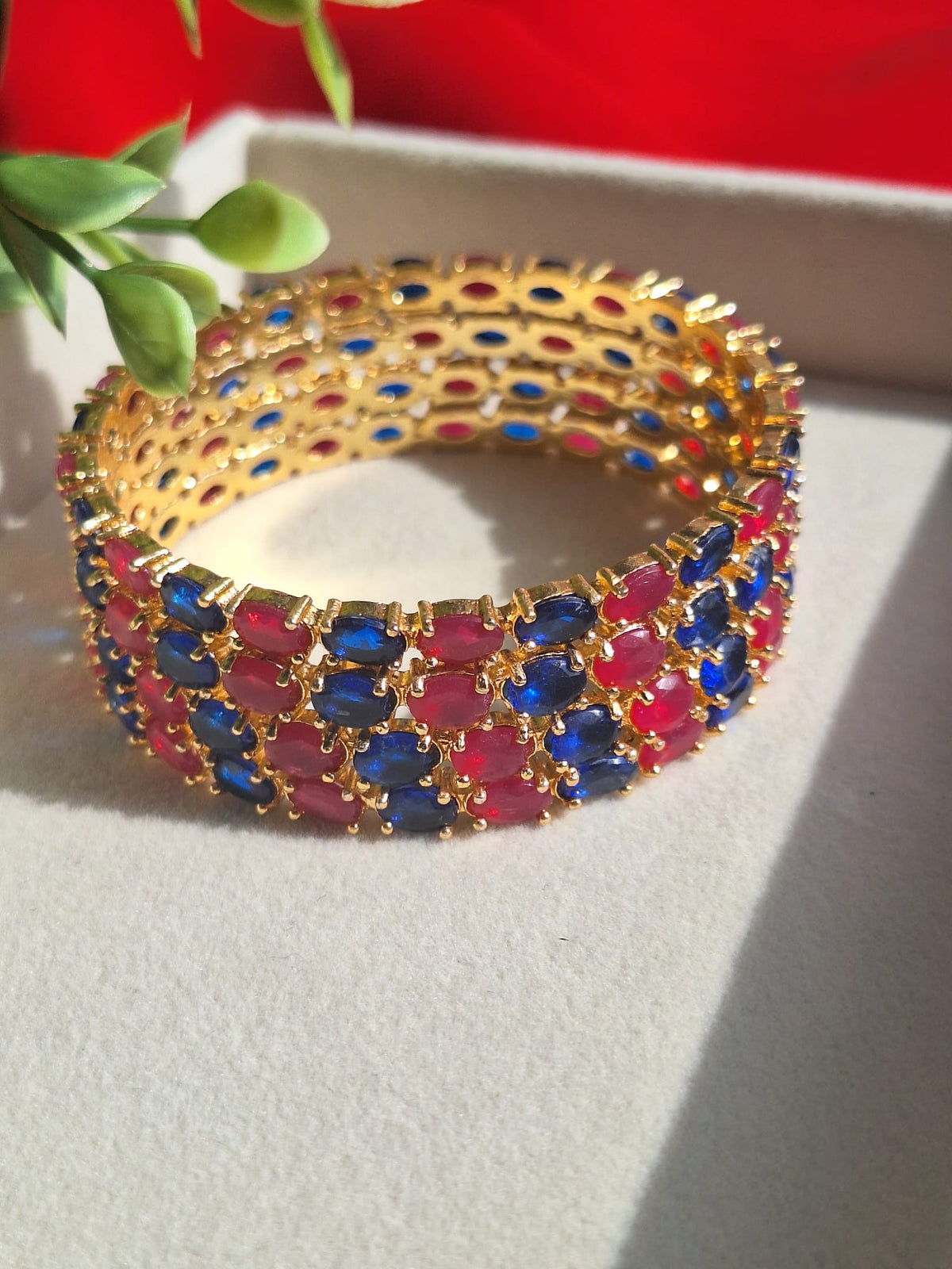 Traditional Multi-Stone Designer Bangles- A high-gloss gold-plated finish that highlights the brilliance of the colored stones.