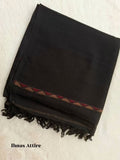 Folded black Pashmina winter wool shawl showcasing a textured weave, detailed border stripe, and fringe tassels on a soft white background.
