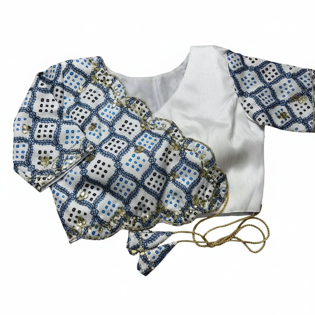 White silk boutique blouse mirror work on a white background sleeves on a gray surface