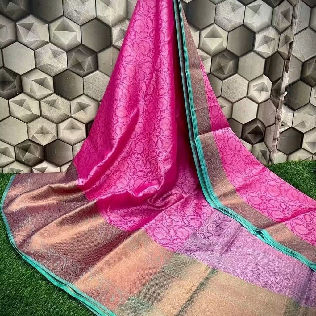 Featuring Traditional Kora Muslin Jacquard Saree.Exceptionally lightweight and soft fabric offering a graceful, smooth drape.Intricate tonal woven patterns covering the entire body of the saree for added depth.