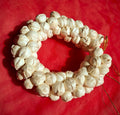 Traditional artificial white floral hair gajra bun ring with gold cord for Indian weddings and ethnic hair styling.