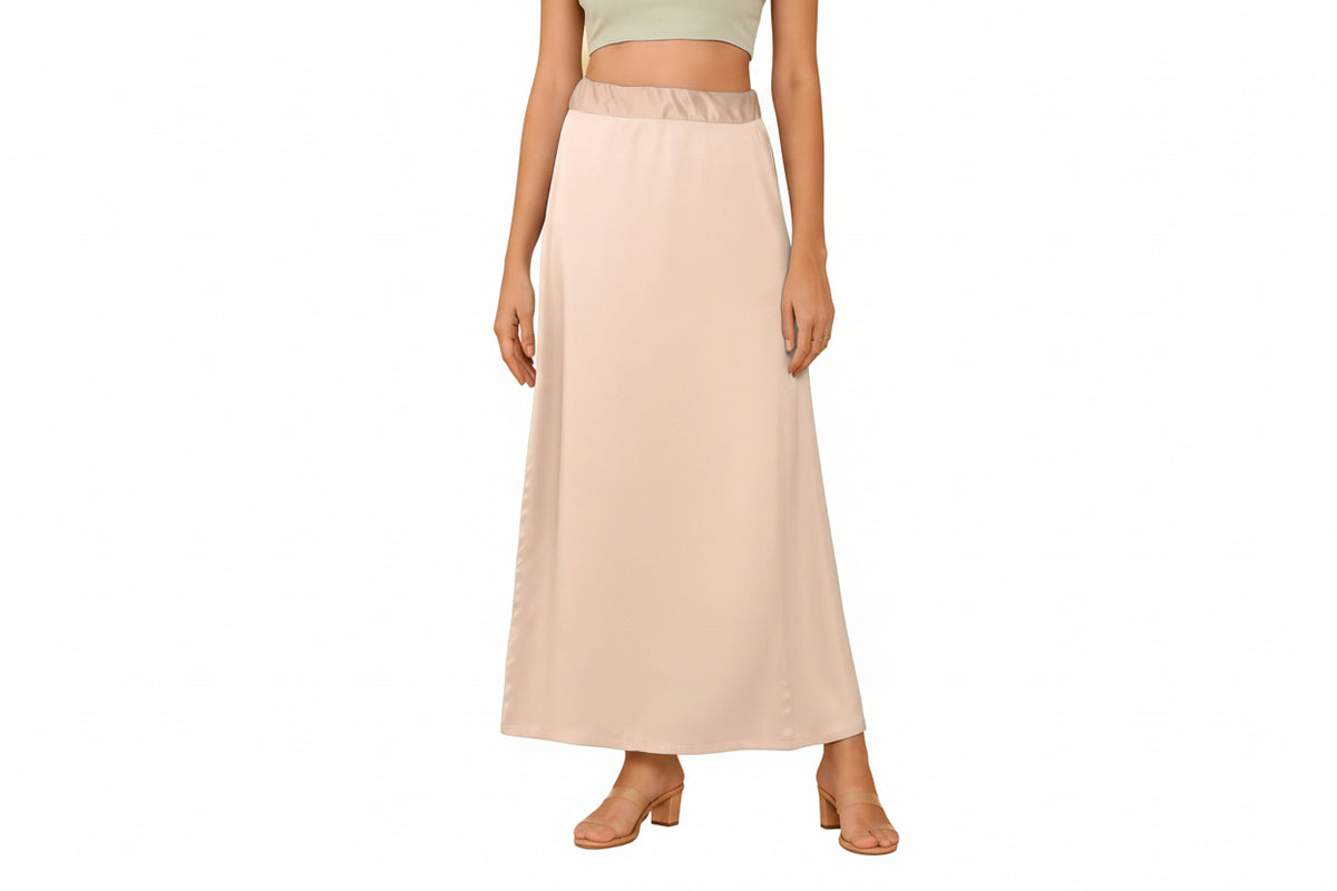 Featuring a woman wearing on a beige color ultra satin silk inskirt on a white background 