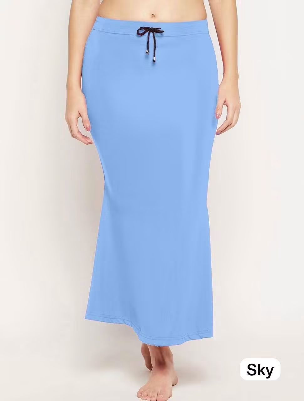 A model wearing a Stretchable Lycra- light blue inskirt with a dark drawstring waistband, shown against a plain light background with a 'Sky' label in the bottom right corner.