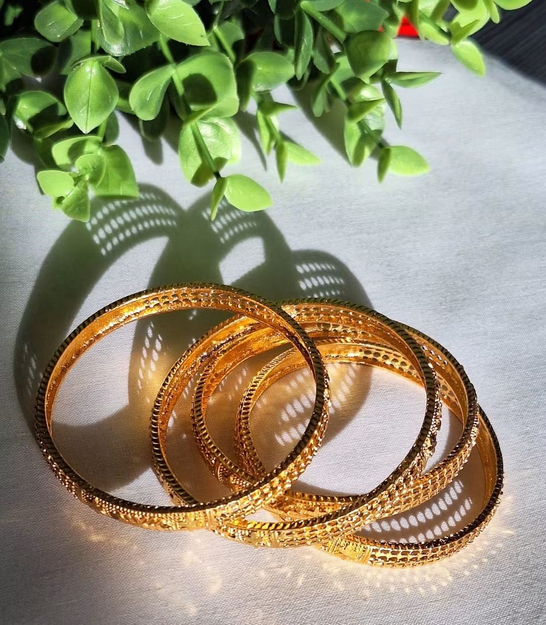 Gold Plated Bangles Set - 4 Pieces in (Size 2.4) with Intricate Cutwork and Floral Motifs