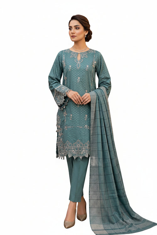 Woman wearing a teal embroidered outfit with a matching dupatta in a white background 