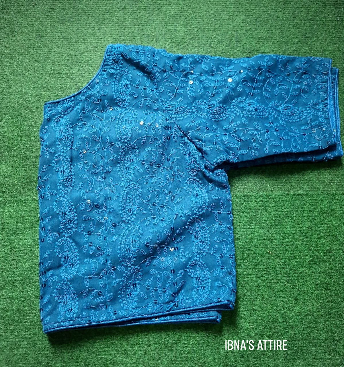 Soft Georgette Chikankari Blouse navy blue color lying on a greeny background