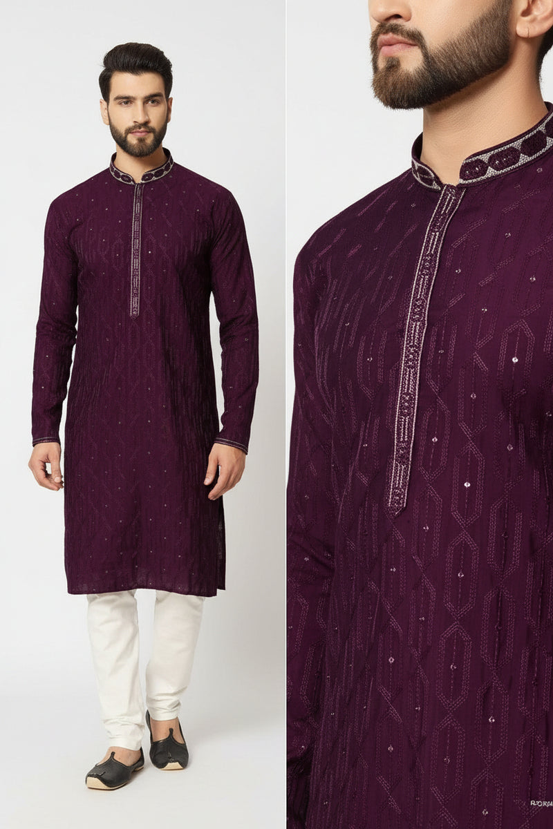 Man wearing a purple kurta with white pants against a white background