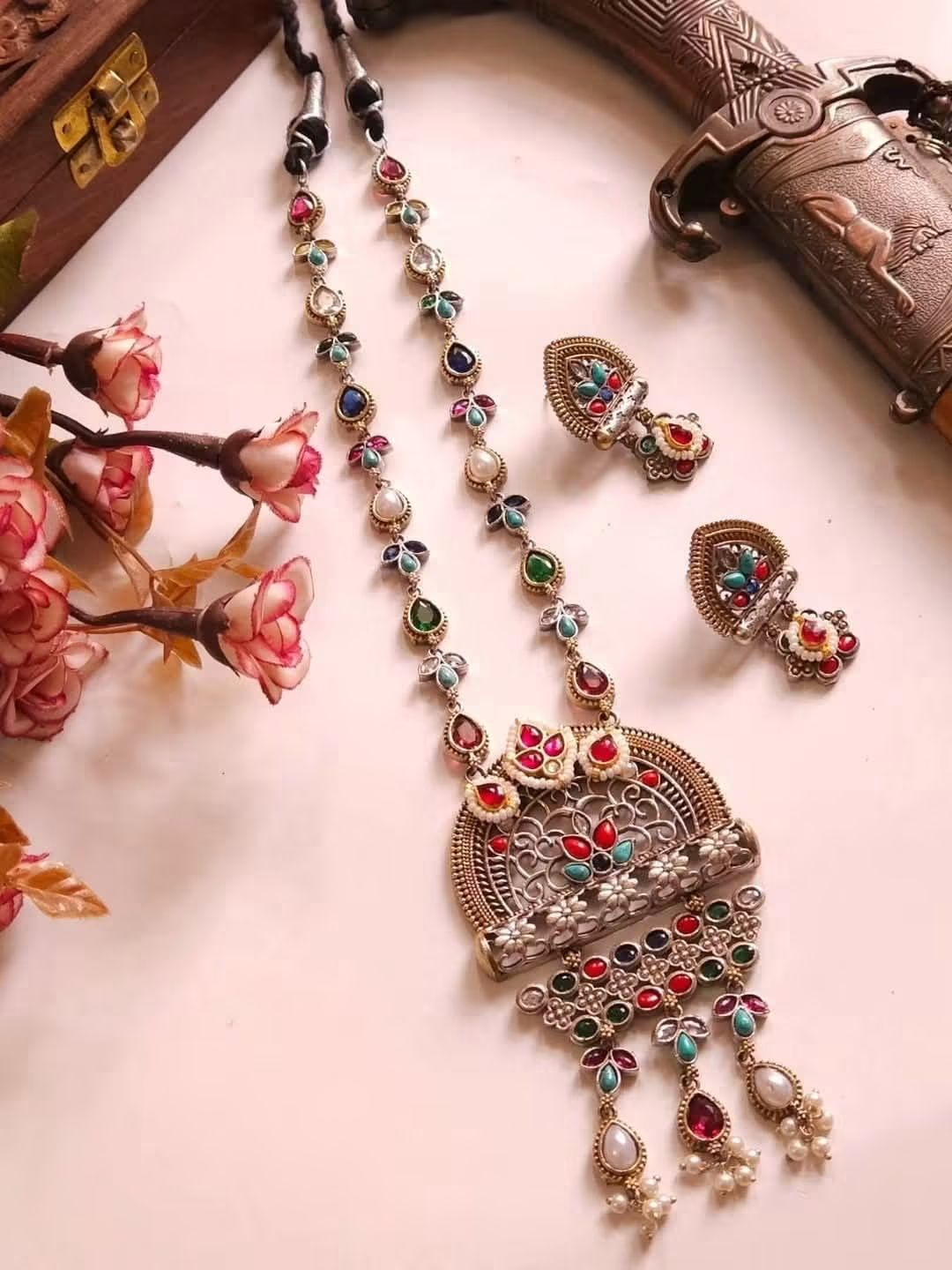 Delicate pearl bead tassels adding traditional grace.