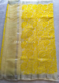 A yellow lakhnouvi work pure kota saree on a white background 