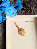 Gold plated American Diamond head piece on a beige color jewelry display box