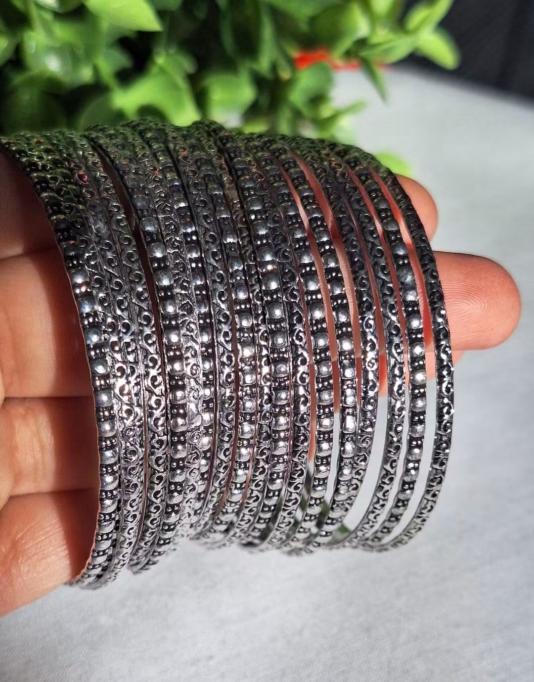 German Silver Oxidized Bangles. Fine, repetitive patterns and bead accents carved along the outer surface.