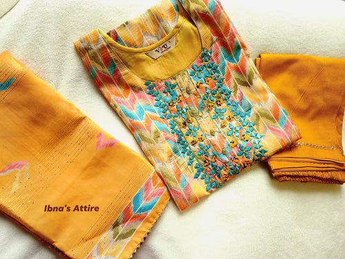 Featuring a A complete outfit pairing the printed kurti, matching bottom pant, and complementary dupatta.Coordinating dupatta finished with shimmering rows of hand-sequenced details.Detailed yoke embellishments featuring reflective mirror accents and colorful threadwork.