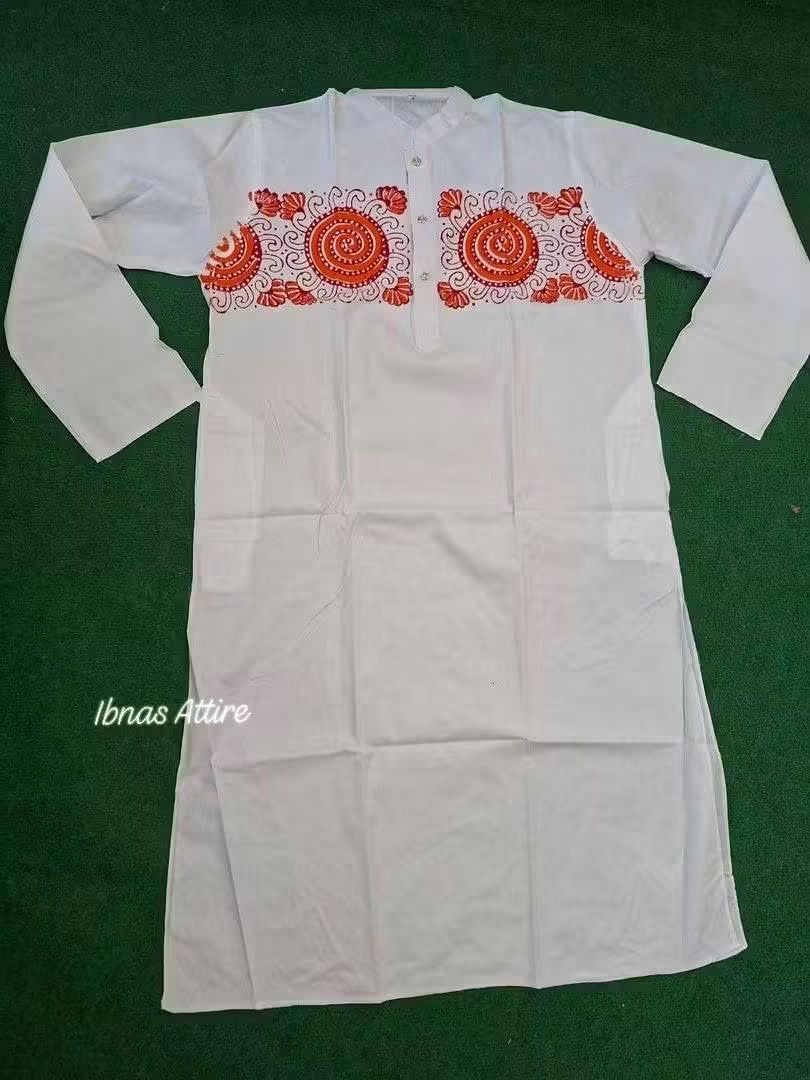 A white long-sleeve panjabi or kurta laid flat on a dark green textured background, featuring red and orange circular floral embroidery across the chest.