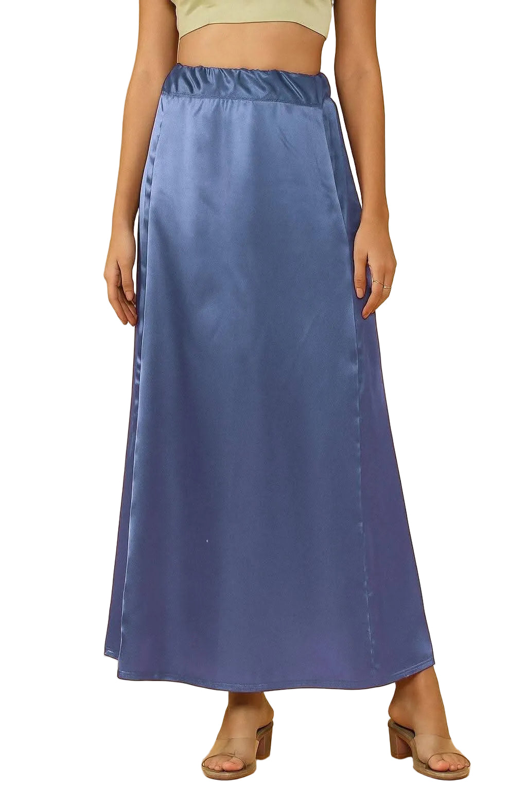A woman models a long satin petticoat skirt in a  blue-gray color, shown from the waist down against a solid white background.