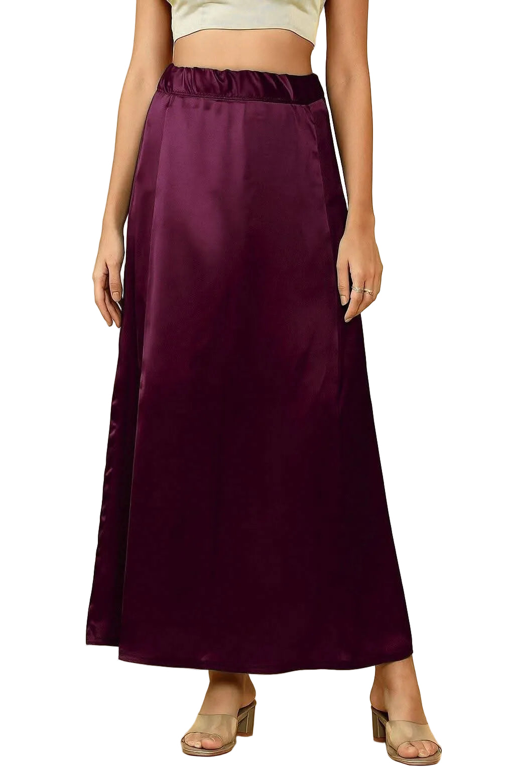 A woman models a long satin petticoat skirt in a deep wine color, shown from the waist down against a white background.