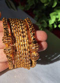 Premium Gold Plated Traditional Indian Bangles Set. High-shine golden plating that delivers an authentic, high-end traditional look.